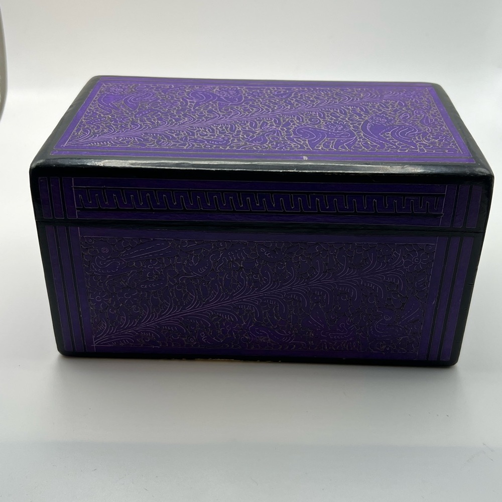 Purple and black carved wooden box.